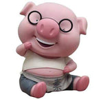 Tirelire cochon avec des lunettes assis